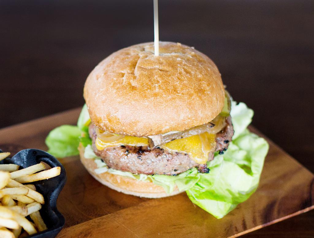 Merchant Burger · Cheddar cheese, caramelized onion, pickles and merchant sauce.
