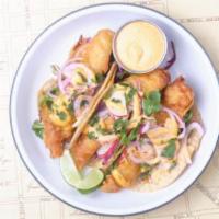 Baja Fish Tacos · crispy fried cod in nixtamal corn tortillas
with citrus arugula, cabbage slaw, chipotle may...