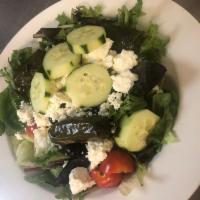 Greek Salad · Mixed greens, tomatoes, cucumbers, Greek olives, feta, anchovies, oregano and our traditiona...