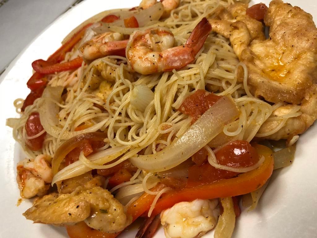 Spicy Jambalaya Pasta · Shrimp and chicken sauteed Cajun style with onions, peppers and tomatoes over ziti or white rice.