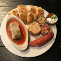 Sampler Plate · Pierogi, choice of pork or beef stuffed cabbage roll, covered with signature tomato sauce or...