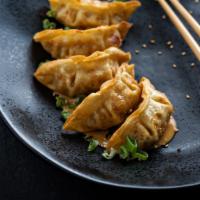 Fried Pork Dumplings · 5 pieces. Pork dumplings deep fried and served with red curry.