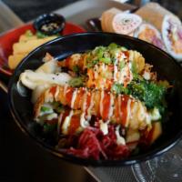 Dynamite Spicy Tuna Bowl · Rice topped with sesame seeds, lettuce, edamame, cucumber, avocado, carrots, cabbage, beets,...