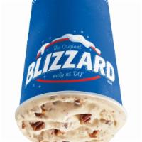 Turtle Pecan Cluster Blizzard Treat · Pecan pieces blended with chocolate, rich caramel and creamy vanilla soft serve.