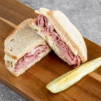#2. Corned Beef Classic Sandwich · Corned beef, Swiss cheese, coleslaw and Russian dressing on seedless rye.