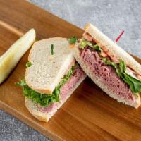 #4. Dinty Moore Sandwich · Corned beef with lettuce, tomato and Russian dressing on rye.
