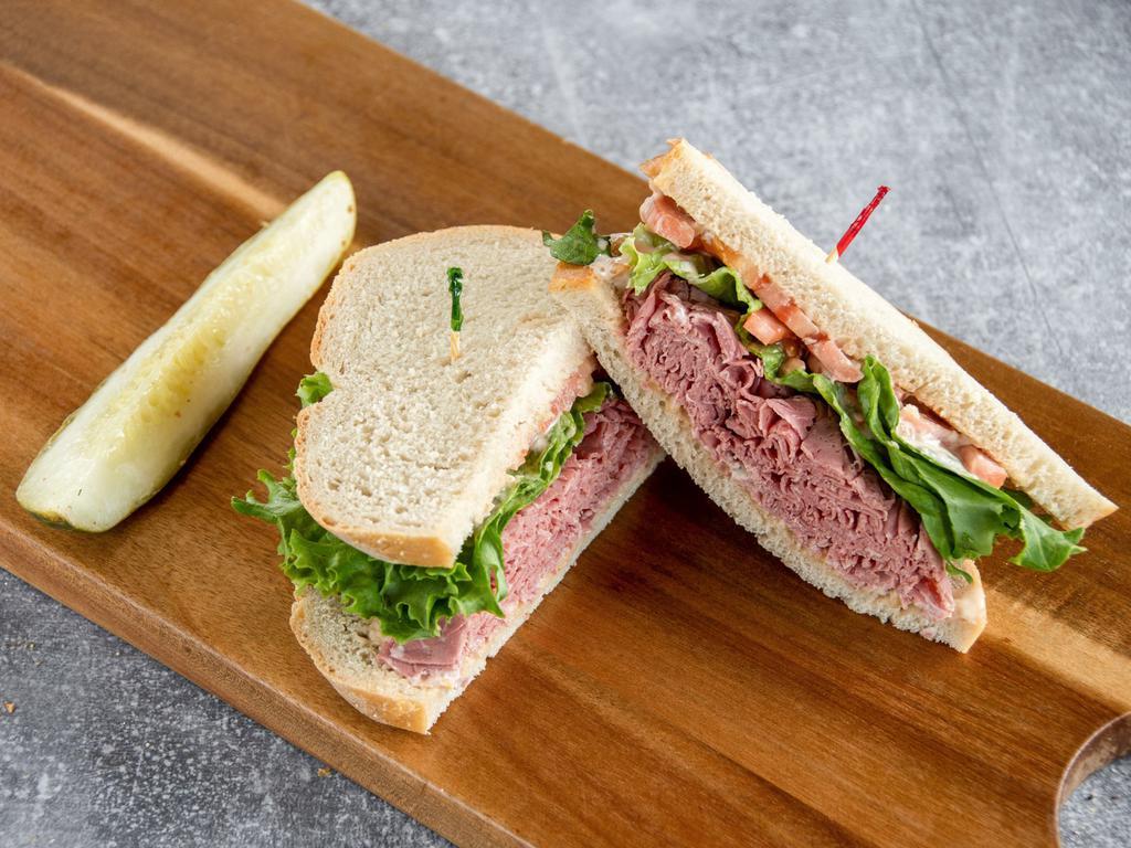 #4. Dinty Moore Sandwich · Corned beef with lettuce, tomato and Russian dressing on rye.