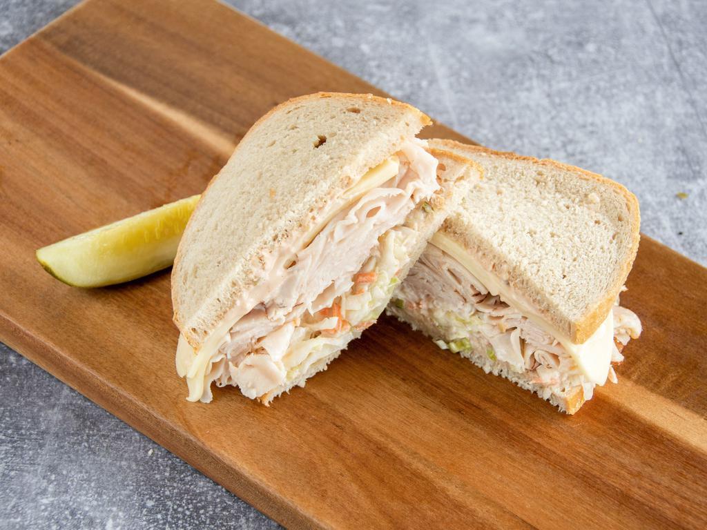 #8. Turkey Favorite Sandwich · Turkey breast, Swiss cheese, coleslaw and Russian dressing on rye.