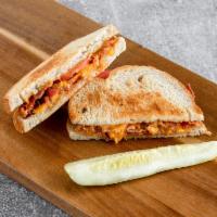 #14. Meaty Grilled Tomato and Cheese Sandwich · Grilled rye with tomato, ham or bacon and your choice of American, cheddar, Swiss, provolone...