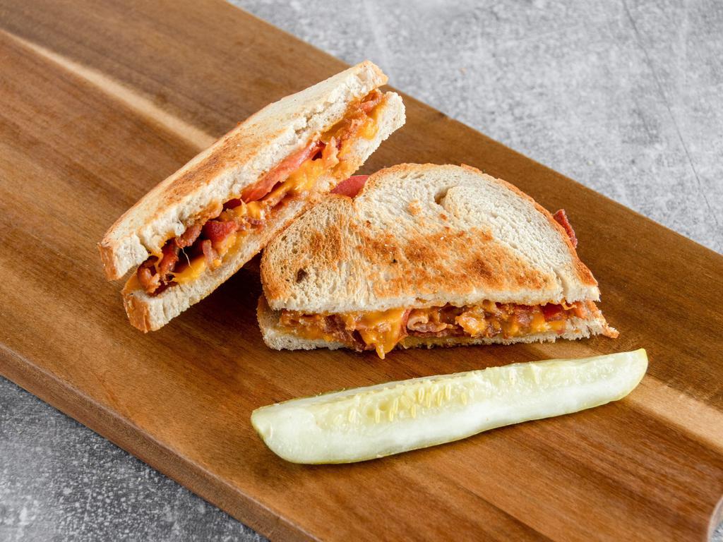 #14. Meaty Grilled Tomato and Cheese Sandwich · Grilled rye with tomato, ham or bacon and your choice of American, cheddar, Swiss, provolone, Muenster or Havarti cheese.