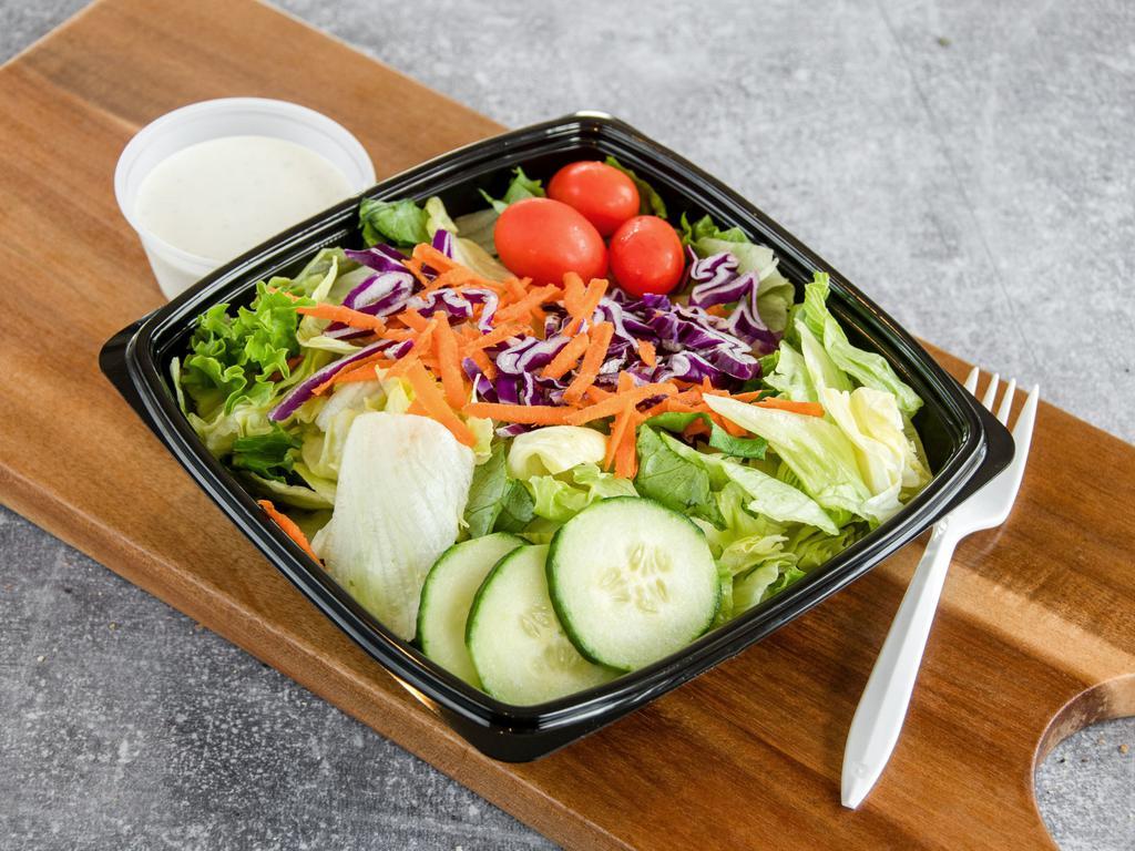 Traditional Tossed Salad · Tossed greens, red cabbage, carrots, tomato and cucumber.