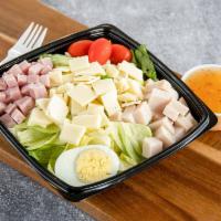Julienne Salad · Tossed greens with cubed turkey, Swiss, ham, sliced hard-boiled egg and tomato.
