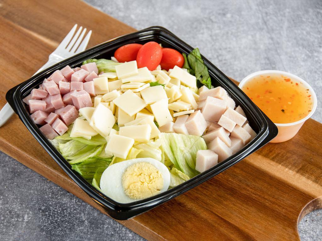 Julienne Salad · Tossed greens with cubed turkey, Swiss, ham, sliced hard-boiled egg and tomato.