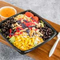 Sante Fe Salad · Tossed greens, tomatoes, corn, olives, black beans, shredded cheese topped with tortilla str...