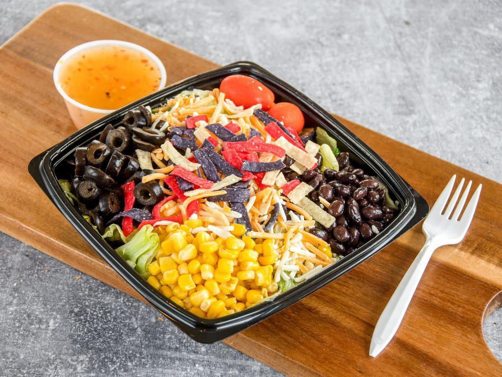 Sante Fe Salad · Tossed greens, tomatoes, corn, olives, black beans, shredded cheese topped with tortilla strips. Try it with our salsa ranch.