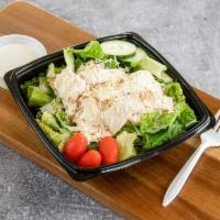 Chicken Caesar Salad · Marinated grilled chicken breast cooled, sliced and fanned over fresh Romaine lettuce sprink...