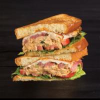 Poseidon Sandwich · Spicy Smoked Ahi Tuna, Griddled Cheese, Housemade Chipotle Aioli and Pickled Onions. Served ...