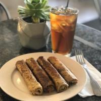 Blinkchik (Beef Crepes) · 2 house-made crepes rolled with seasoned ground beef, onion and spices; pan fried in butter;...