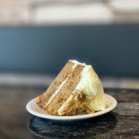 Carrot Cake · a piece of our house-made moist, rich carrot cake with cream cheese frosting;  garnished wit...