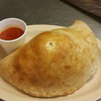 Calzone Special · Ricotta, mozzarella, and ham all wrapped in pizza dough and baked to perfection.