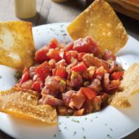 Spicy Tuna Crunch · Diced Tuna, tomato, green onion and smelt egg with crispy wonton skin