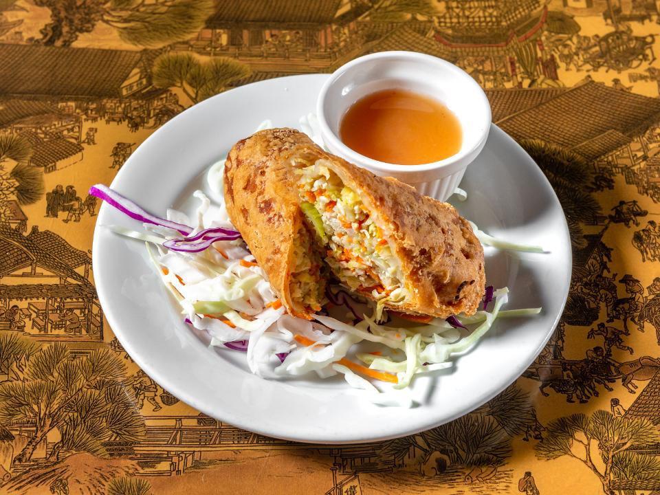 Chinese Egg Roll (1) · Stir-fried cabbage, carrot, celery, and chicken wrapped in wonton skin; battered and deep fried. Served with plum sauce.