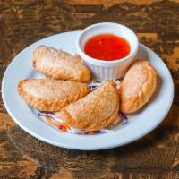 Curry Puff (4) · Puff pastries filled with chicken, onion, potato, savory curry seasoning. Served with sweet ...