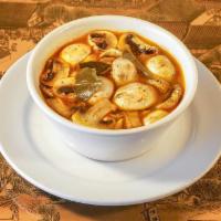 Tom Yum Hed · Button mushrooms in spicy Thai lemongrass herb broth.