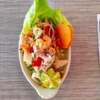 Ceviche Mixto · Combination of shrimp, calamari and fish, with lime, tomatoes, cilantro, jalapenos, red onio...