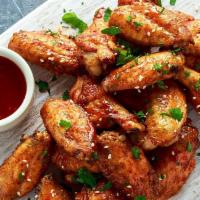 Vietnamese Butter Wings  · Crispy wings infused with butter and house special sauce