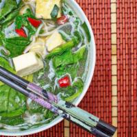 Vegan Pho noodle soup · Vegan Noodle soup with special vegetarian soup base served with broccoli, carrot, mushroom, ...