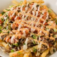 Tiger Fries Small Plate · French fries loaded with kalbi beef, kimchi, green onion, onion, white sesame, sweet and spi...
