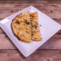 Garlic Naan · Naan with a touch of garlic. Baked in a clay oven.
