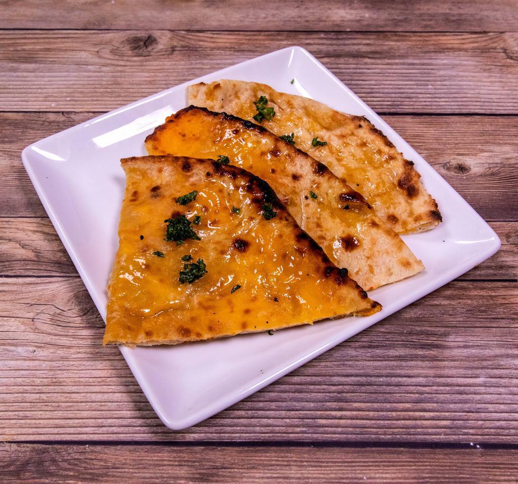 Cheese Naan · Naan stuffed with cheese. Baked in a clay oven.
