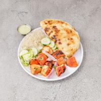 Chicken Tikka Kabab · Chunks of chicken breast marinated in ginger, garlic and house spices. Served with naan, ric...