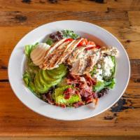 Mona's Cobb Chicken Salad · Romaine lettuce, mixed greens, bacon, grilled chicken, hard boiled egg avocado, crumbled blu...