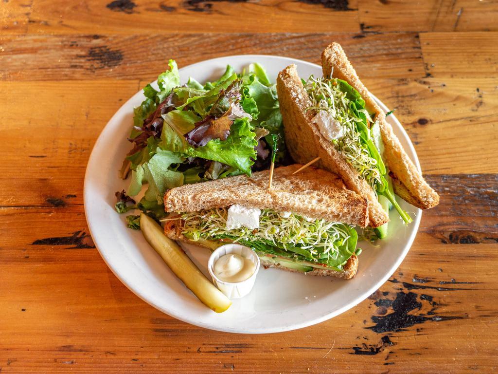 Veggie Sandwich · Roasted bell peppers, goat cheese, fresh spinach, sprouts, pesto sauce, cucumber and wheat bread.
