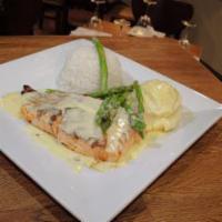 Blackened Salmon · Comes with a lemon butter sauce, served with wild rice and asparagus, and topped with tomato...