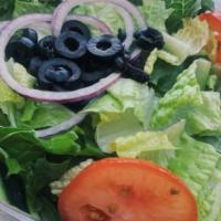 Garden Salad · Crisp and fresh romaine hearts, plump Roma tomatoes, red onions, cucumber, and black olives....