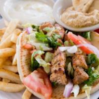 Chicken Souvlaki Sandwich · Grilled chicken wrapped in a pita with tomatoes, red onions, lettuce and tzatziki sauce.