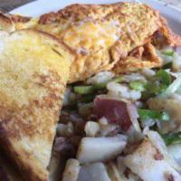 Ham Omelet Combo · Ham and cheese. Comes with a side of potatoes and toast.