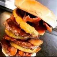 Western Bacon Burger · Burger topped with BBQ Sauce, Onion Rings, Cheese & Bacon