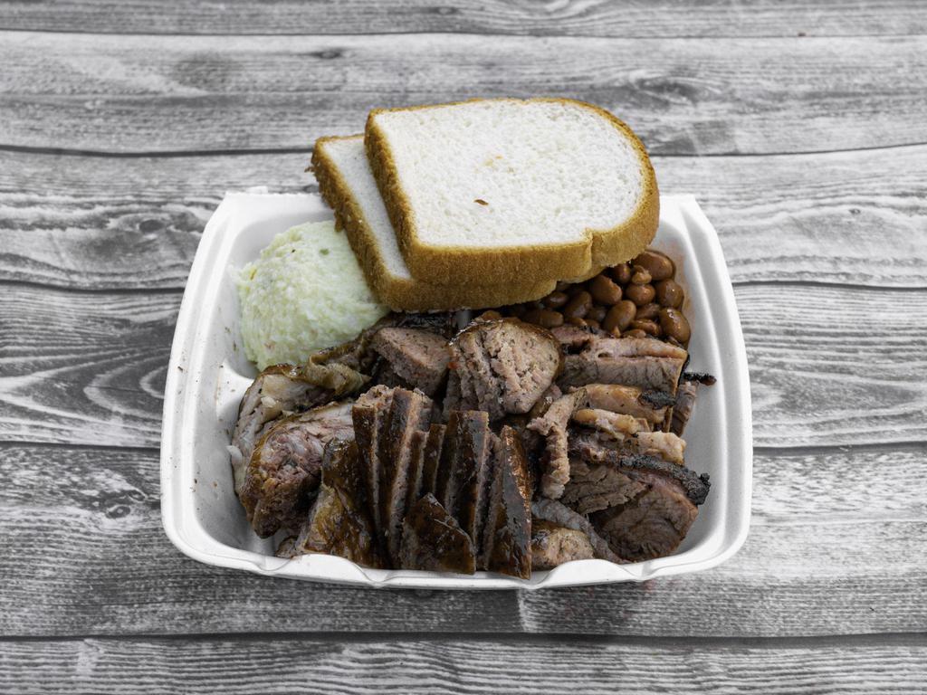 3 Meat Plate · Meat options between Chicken, Brisket, Pork Rib, & Homemade Sausage with 2 sides, sauce, and bread.