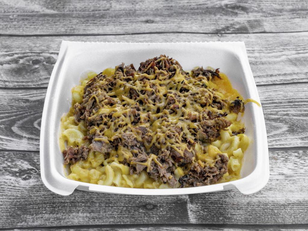 CRACK MAC · SMOKEY CREAMY MAC & CHEESE WITH MUSHROOMS, YOUR CHOICE OF MEAT, AND A DRIZZLE OF BIG 6 SAUCE 