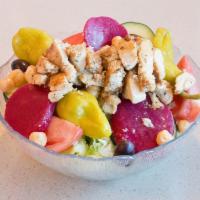 Leo's Famous Greek Salad · Made with lettuce, tomato, cucumber slices, pepperoncini, Greek olives, beets, chickpeas, fe...