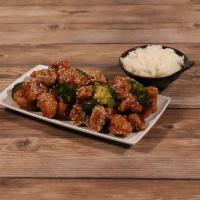 Sesame Chicken · Crispy chunks of boneless chicken sauteed with special brown sesame sauce. Served with brocc...
