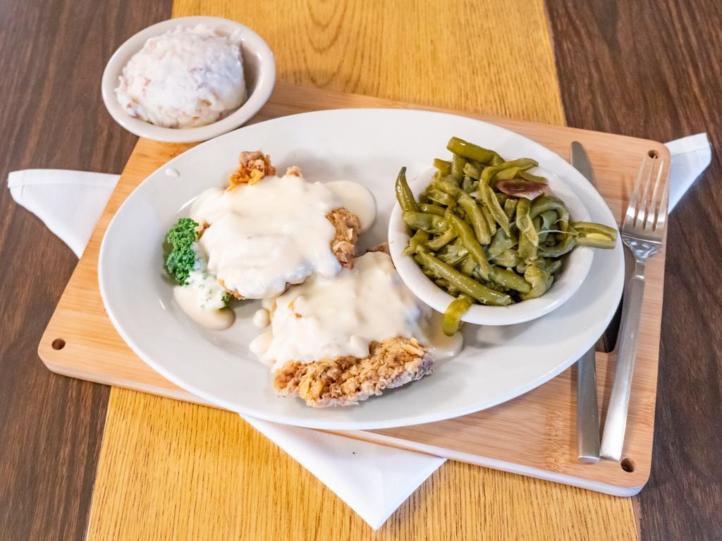 Half-Order Chicken Fried Steak · 1/2 -portion of our famous hand battered chicken fried steak served with cream gravy, salad and french fries, or green beans and mashed potatoes.