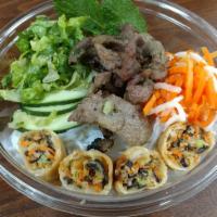 Grilled Pork -Bowl · Rice noodles, egg roll, lettuce, pickle vegs, cucumbers, mints and scallion oil. Served with...
