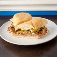 Cuban Sandwich · On cuban bread, made with Roast pork, ham, swiss cheese, pickles, mustard and mayo