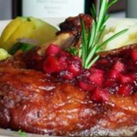 Roasted Duckling · Served with a sherry wine demi-glaze, topped with our homemade cranberry relish.